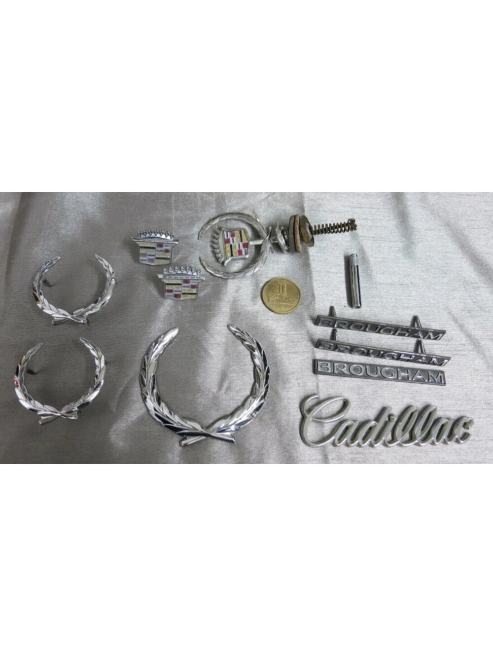vintage Cadillac Broughman hood and side emblems